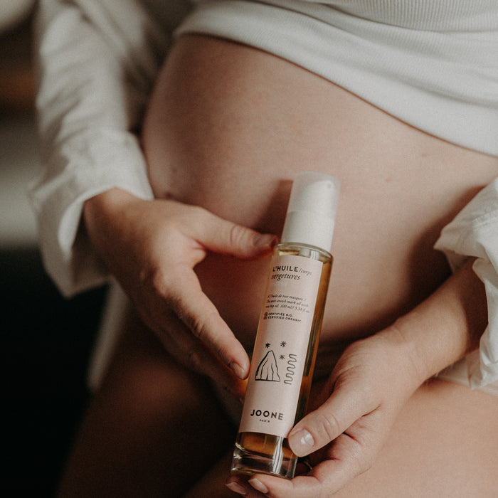 À quel moment de la grossesse devrais-je commencer à utiliser une huile anti-vergeture ?